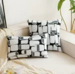 Housses de coussin Magnesite géométriques noir et blanc sur canapé blanc - coussins décoratifs modernes